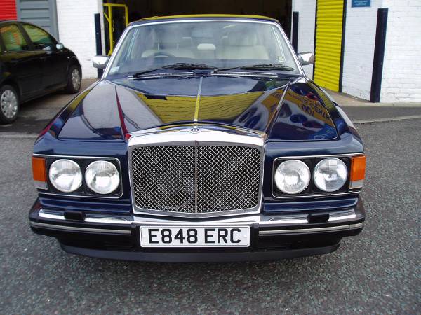 Panel repair on a Bentley, colour-matched and finished in our low-bake oven to a premium standard.