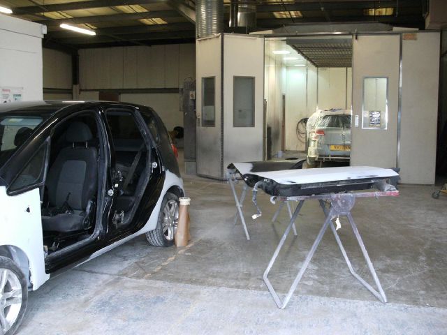 Inside the Phoenix workshop, with vehicles prepped for painting
