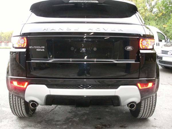 Panel repair and colour-matched respray of a Range Rover, finished in our low-bake oven.